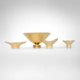 Bowls, set of four by Paavo Tynell, c. 1945, brass, sold Apr 2026
