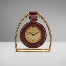 Stirrup desk clock by Paul Dupré-Lafon for Hermès, c. 1930, leather, brass, sold Jun 2025