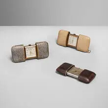 Collection of three purse clocks by Hermès, c. 1955, leather, gilt metal, silver, sold Jun 2025