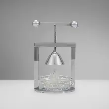 Jacques Adnet, Citrus presser, c. 1935, chrome-plated metal, glass