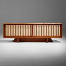 George Nakashima, Conoid room divider cabinet, 1985, cherry, pandanus cloth