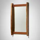Wall-hanging mirror by George Nakashima, 1968, American black walnut, mirrored glass, sold Sep 2025
