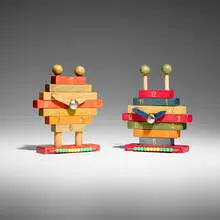 Rare building block toy clocks, set of two by Ettore Sottsass, c. 1965, dyed wood, gold leaf, stainless steel, plastic, sold Mar 2026
