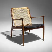 Lounge chair, model 18-15 by Ib Kofod-Larsen, c. 1960, beech, cane, leather upholstery, brass, sold Mar 2026