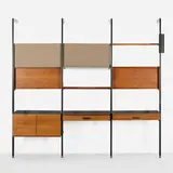 CSS (Comprehensive Shelving System) by George Nelson & Associates, 1959, enameled and brushed aluminum, walnut veneer, laminate, fabric, sold Feb 2026