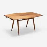 Special-order Boat-Shaped extension dining table by George Nakashima, 1957, American black walnut, rosewood, sold Feb 2026