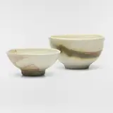 Tea bowls, set of two by Toshiko Takaezu, c. 1985, glazed porcelain, sold Aug 2025