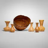 Collection of five vessels and six nesting bowls by Melvin Lindquist and Mike Mahoney, 1974-85, madrone, maple, birch, Osage orange, sold Aug 2025