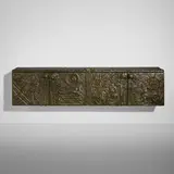 Paul Evans, Sculpted Bronze wall-mounted cabinet, 1973, bronzed resin over wood, enameled steel, slate, lacquered wood