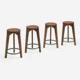 Stools from Punjab University, Chandigarh, set of four by Pierre Jeanneret, c. 1965, teak, painted steel, sold Feb 2026