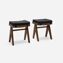 Low stools from the M.L.A. Flats building, Chandigarh, pair by Pierre Jeanneret, c. 1955-56, teak, upholstery, cane, sold Feb 2026