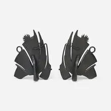 Andirons, pair by Albert Paley, 1996, forged and fabricated steel with a blackened finish, sold May 2025
