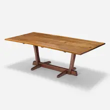 Conoid dining table by George Nakashima, 1965, American black cherry, rosewood, sold May 2025