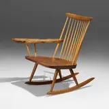 Lounge Rocker with Right Arm by Mira Nakashima, 1994, American black walnut, myrtle burl, sold May 2025
