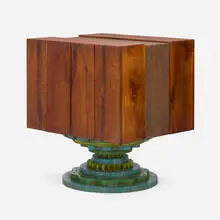 Rotating cabinet by Phillip Lloyd Powell, c. 1965, walnut, carved and painted wood, cane, felt, sold May 2025