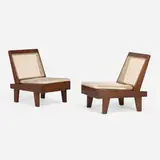 Folding armless easy chairs from the Private Residences, Chandigarh, pair by Pierre Jeanneret, c. 1960, teak, cane, hide, sold May 2025