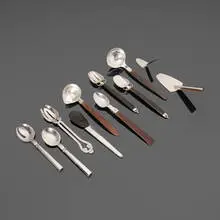 William Philip Spratling, Collection of nine serving articles, c. 1940-1967, sterling silver, ebony, rosewood, silver