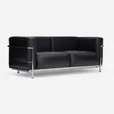 Sofa by Charlotte Perriand, Pierre Jeanneret, and Le Corbusier, c. 1995, leather, chrome-plated steel, sold Jan 2026