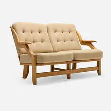 Grégoire settee by Robert Guillerme & Jacques Chambron, c. 1965, oak, wool upholstery, sold Jan 2026