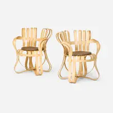 Cross Check armchairs, set of two by Frank Gehry, 1992 / 2004, laminated maple, upholstered cushion, sold Jan 2026
