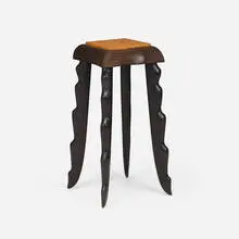 Four-Legged table by Wendell Castle, 1992, ebonized mahogany, ash burl, sold Jan 2025