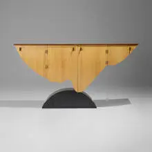 Nose to the Grindstone cabinet by Wendell Castle, 1989, mahogany veneer, maple, English brown oak veneer, Swiss pear, mahogany, oak, black granite, brass, sold Jan 2025