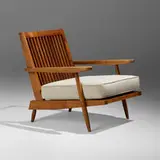 Cushion Chair with Arms by George Nakashima, American black walnut, upholstered cushion, sold Jan 2025