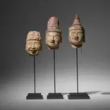Southeast Asian, Collection of three articulated puppet heads, painted and carved wood