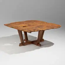 Exceptional Bryfogle table by Mira Nakashima, 1997, English oak burl, East Indian laurel, American black walnut, sold Jan 2025