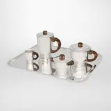 Émile Puiforcat, Four-piece coffee and tea service with associated tray, c. 1925, sterling silver, ebony, silverplate