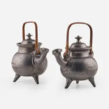 Jean Marais, Teapots, pair, c. 1965, high temperature glazed ceramic, rattan