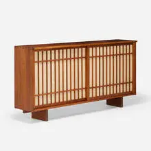 George Nakashima, Special-order Sliding Door cabinet, 1970, American black walnut, pandanus cloth