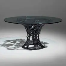 Breakfast table by Albert Paley, 2006, forged and fabricated steel with a blackened finish, glass, sold Sep 2024