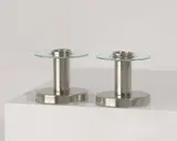 Naum Slutzky, C Paar Kerzenständer, Um 1930, Neusilber, vernickelt, mattiert; Glas. 6,5 cm; Ø 7,5 cm (2 ½ in.; Ø 3 in.)
