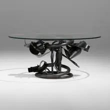 Round End Table by Albert Paley, 1991, forged and fabricated steel with a blackened finish, glass, sold May 2024