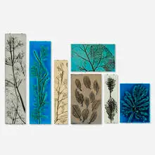 Collection of seven botanical wall plaques by Toini Muona, c. 1960, glazed stoneware, sold Nov 2025