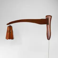 Wall-mounted lamp for the Hurwitz House, Doylestown by Wharton Esherick, 1965, cherry, enameled metal, sold May 2024