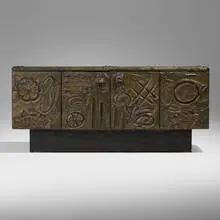 Sculpted Bronze cabinet by Paul Evans, 1972, bronzed resin over wood, slate, patinated steel, sold May 2024