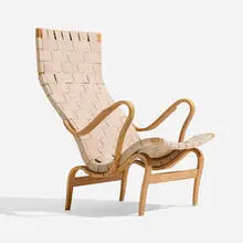 Pernilla 2 lounge chair by Bruno Mathsson, 1944 / 1970, laminated and steam-bent beech, canvas webbing, sold Nov 2025