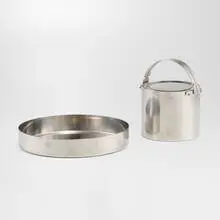 Cylinda ice bucket and tray by Arne Jacobsen, 1967, stainless steel, sold Feb 2024