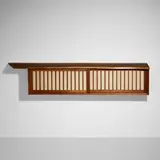 Hanging Wall cabinet by George Nakashima, 1968, American black walnut, pandanus cloth, sold Jan 2024
