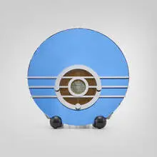 Bluebird radio, model 566 by Walter Dorwin Teague, c. 1935, blue Tufflex mirrored glass, chrome-plated steel, painted wood, Bakelite, sold Nov 2025