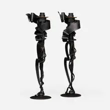 Albert Paley, Millennium candleholders, pair, 1998, forged and fabricated steel with a blackened finish, removable brass bobeches (collars)