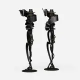 Albert Paley, Millennium candleholders, pair, 1998, forged and fabricated steel with a blackened finish, removable brass bobeches (collars)