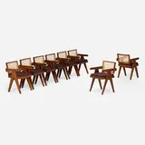 Office Cane chairs from Chandigarh, set of eight by Pierre Jeanneret, c. 1960, teak, cane, upholstery, sold Jan 2024