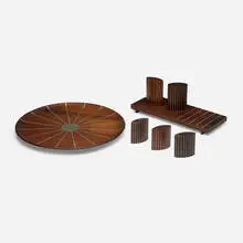 Collection of seven tabletop accessories by Paul Evans and Phillip Lloyd Powell, 1956-57, walnut, pewter, cork, sold Jan 2024