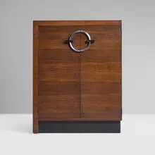 Gilbert Rohde, Cabinet, model 3426, c. 1940, East Indian laurel, lacquered wood, chrome-plated steel