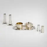 Collection of table articles by Merle F. Faber Products, c. 1945, silver-plated brass, sold Nov 2025