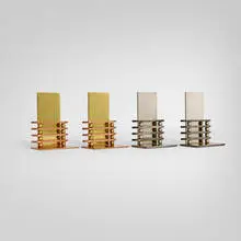 Octaball bookends, two pairs by Walter von Nessen, c.1935, chrome and brass-plated steel, copper, sold Nov 2025