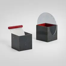 Cube cigarette holder, model 17070 and ashtray by Walter von Nessen, c. 1930, enameled and chrome-plated metal, sold Nov 2025